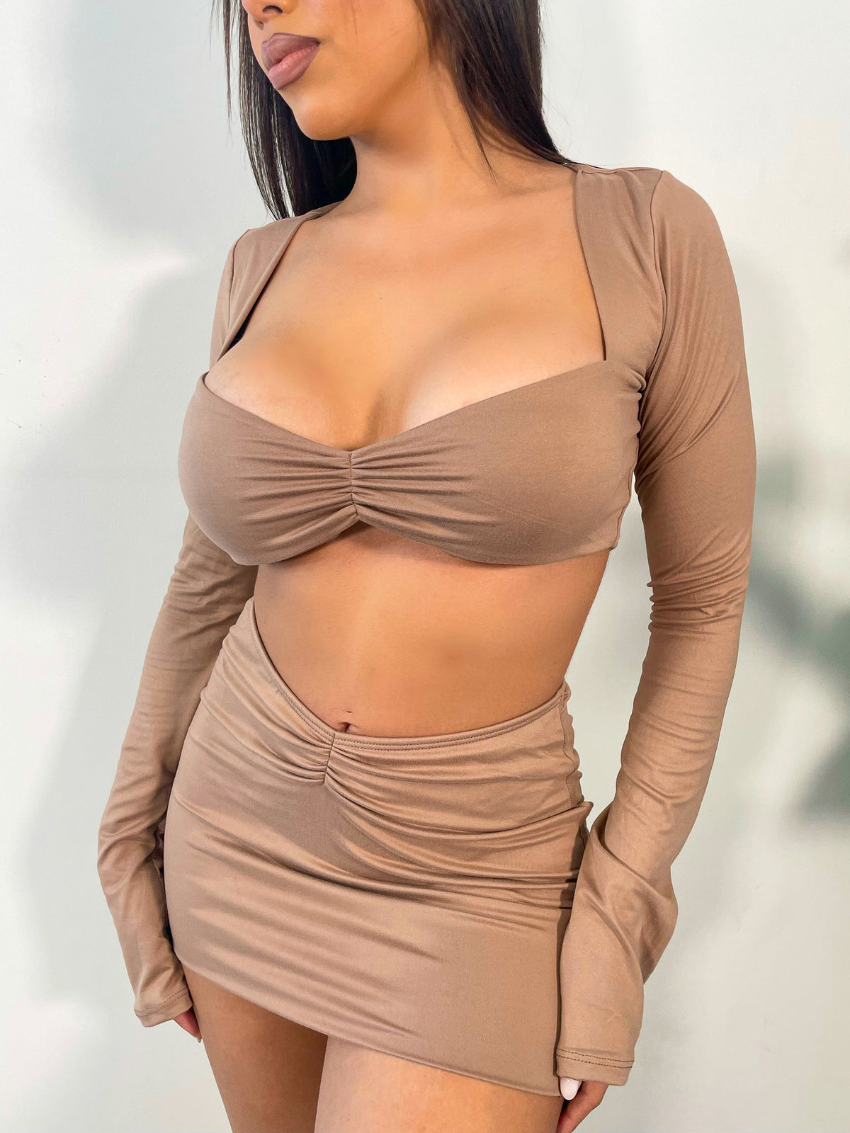 tan 2 piece, long sleeve crop top, ruched front detail, high waisted mini skirt