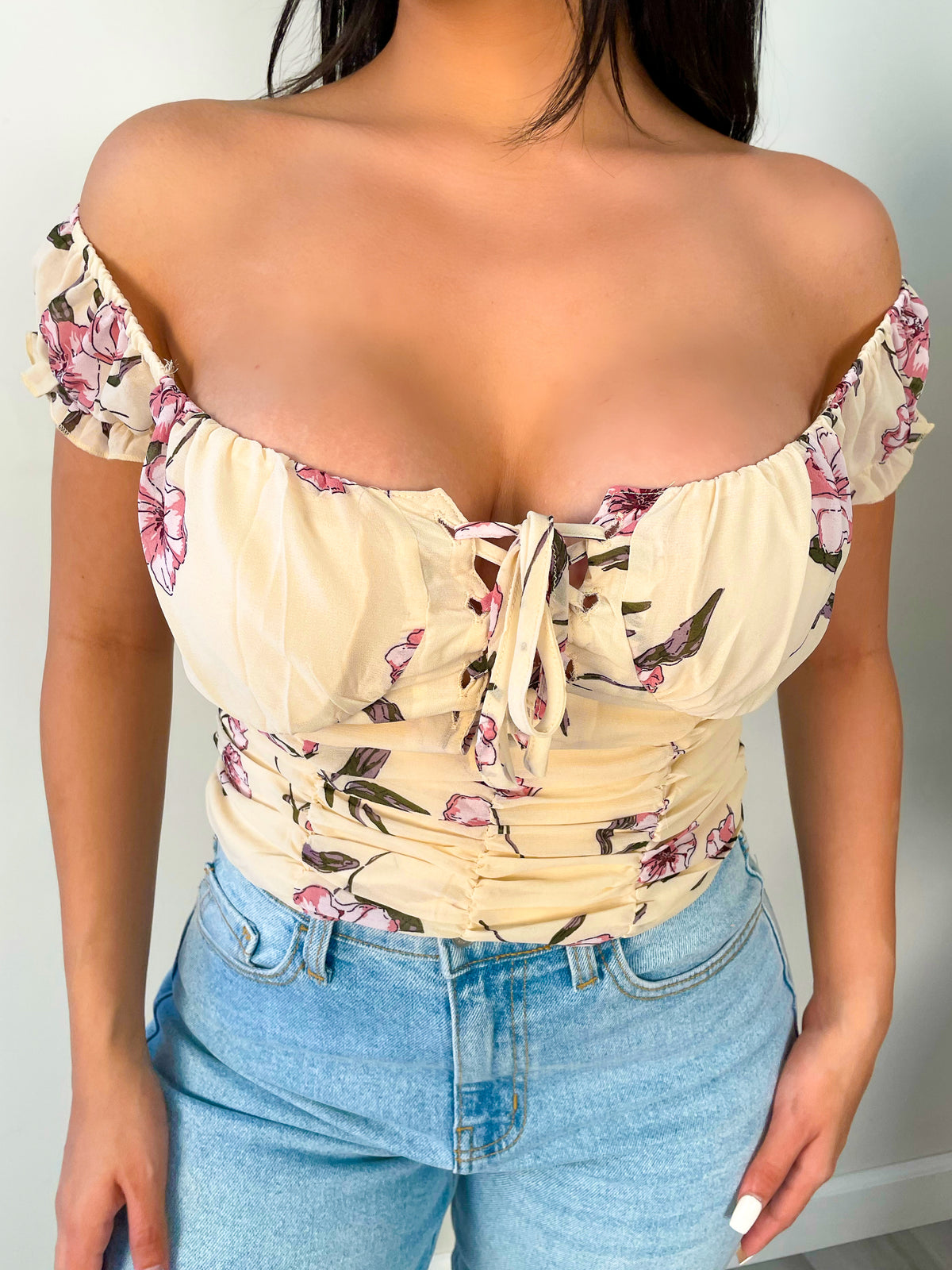 cream floral top, above belly button length, tie top, off the shoulder, short sleeve