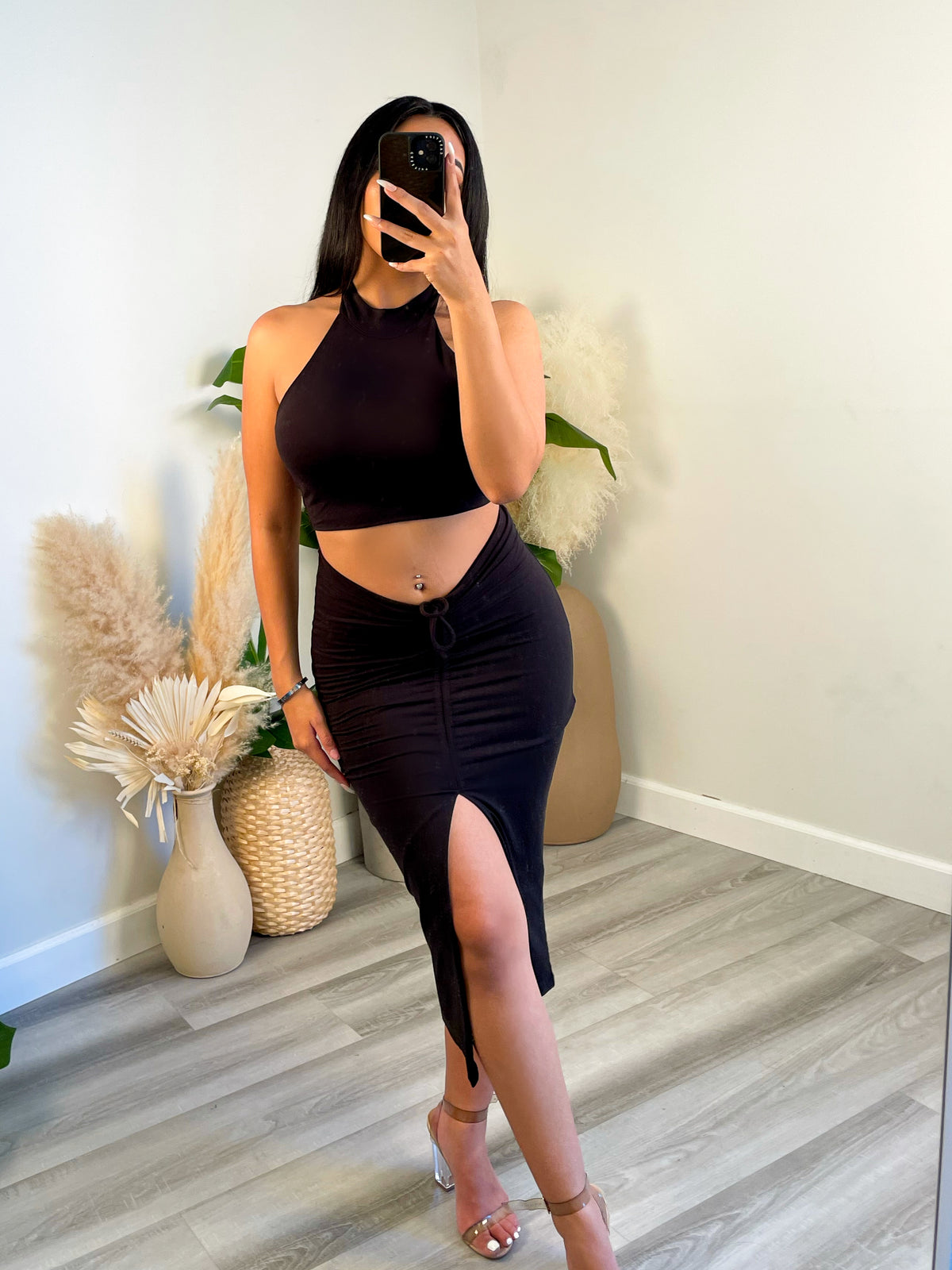 black 2 piece, halter top, high neck, crop top, high waisted skirt, middle slit and scrunch 