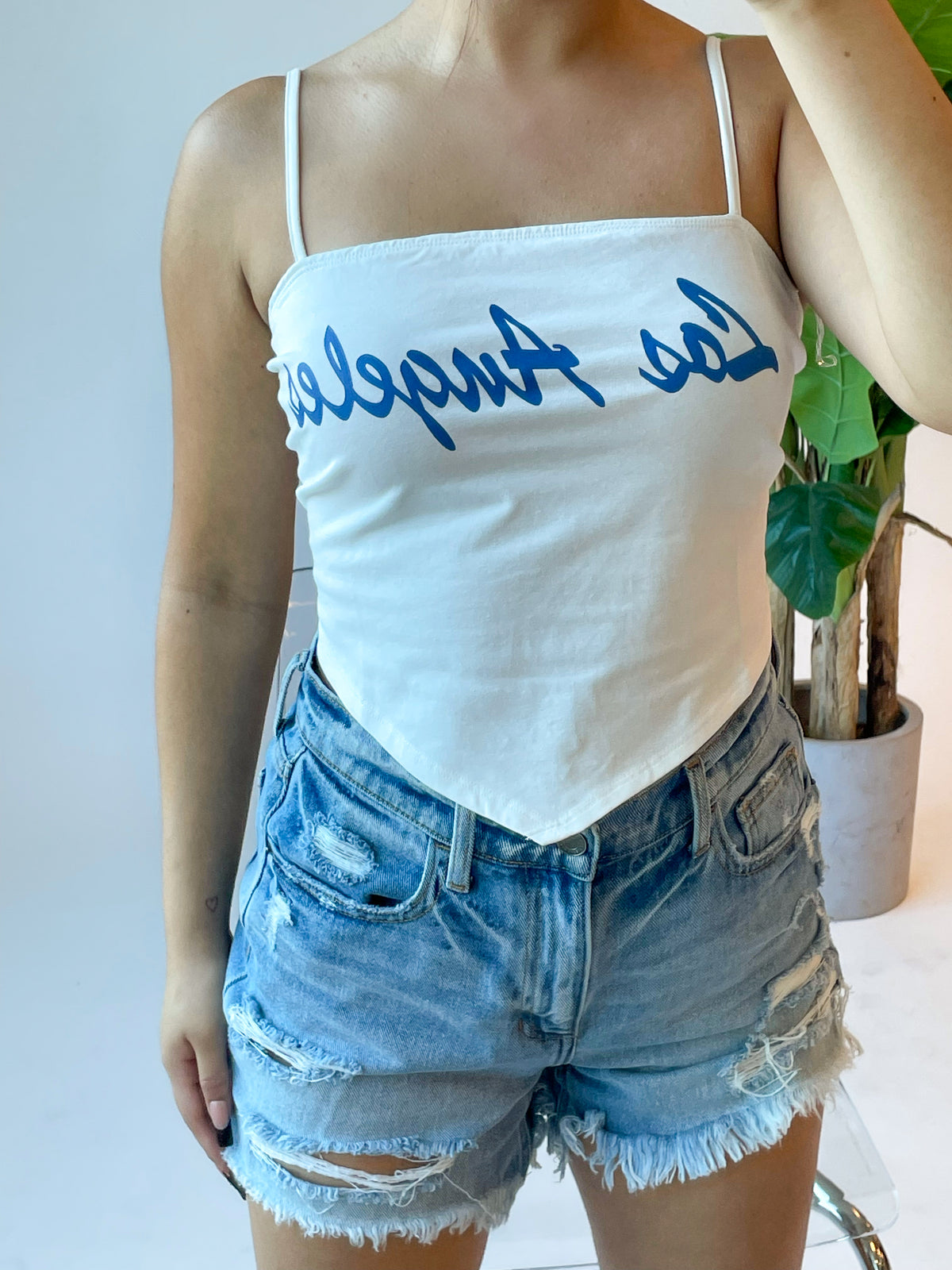 ivory los angeles top, blue font, spaghetti strap, adjustable straps, self tie back, triangle cut out