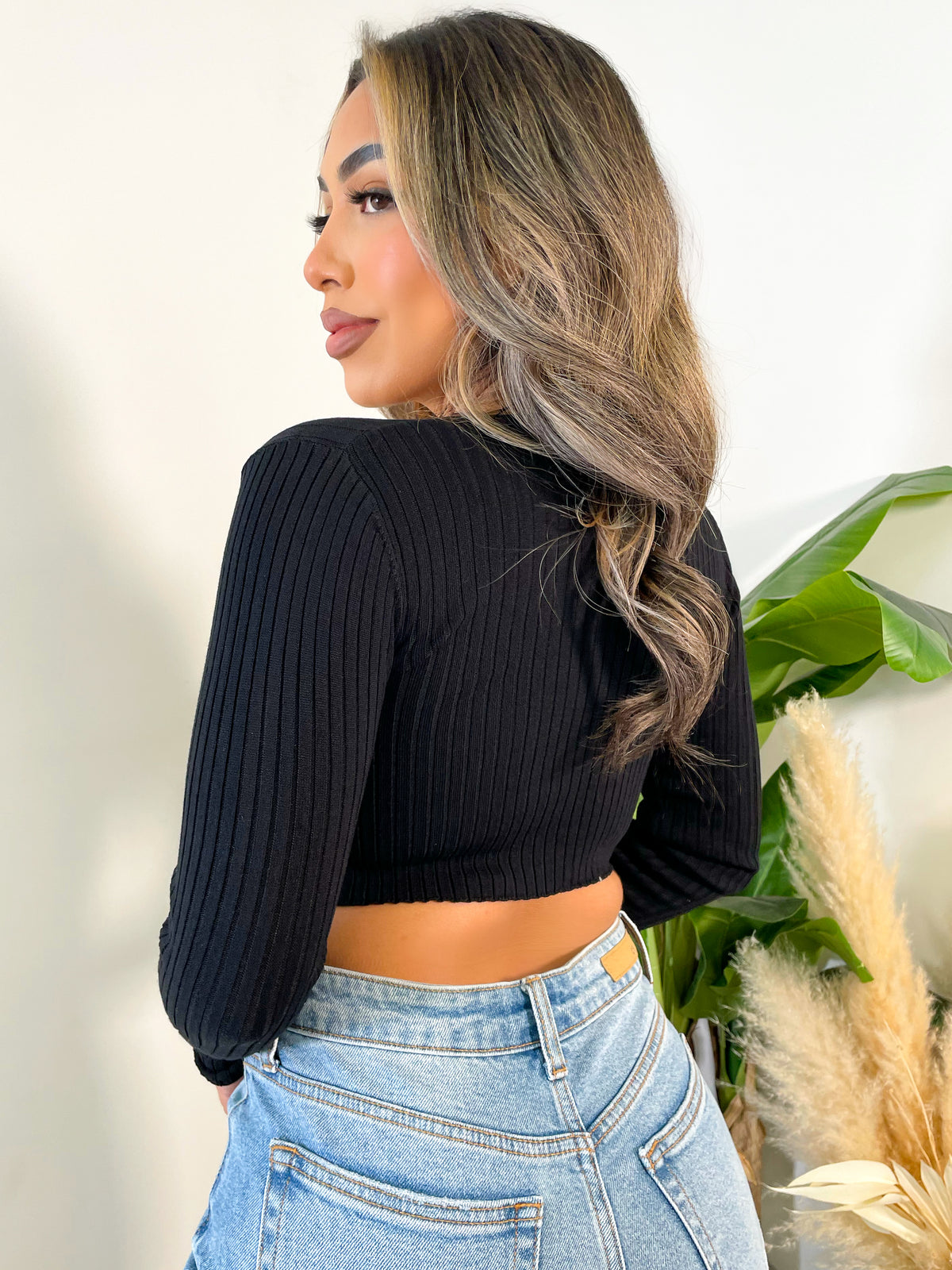 black long sleeve top, crop top, ribbed, criss cross front, wrap around straps, v neck