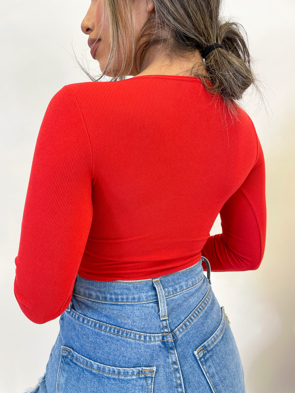  red long sleeve crop top, scoop neck, middle scrunch tie, ribbed, front cutout