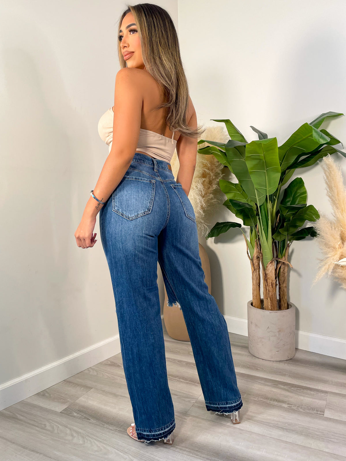 medium wash jeans, high waisted, knee rips, distressed jeans, 2 front/back pockets 