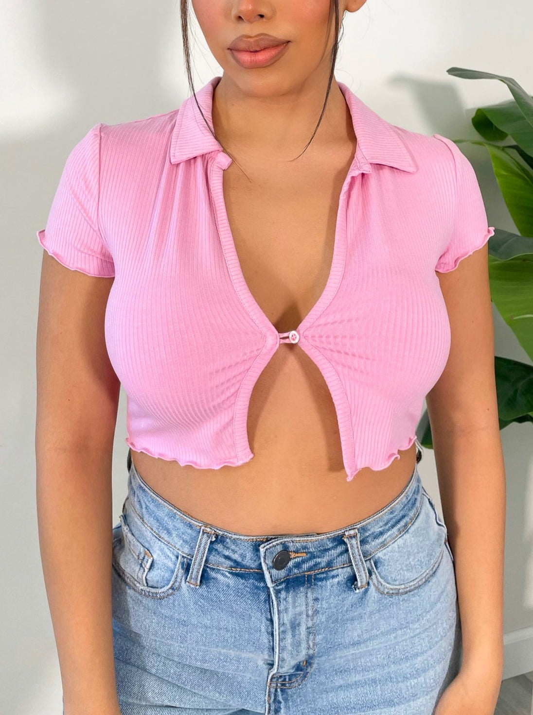 pink crop top, short sleeve, collar, single button front closure, lettuce trim detail