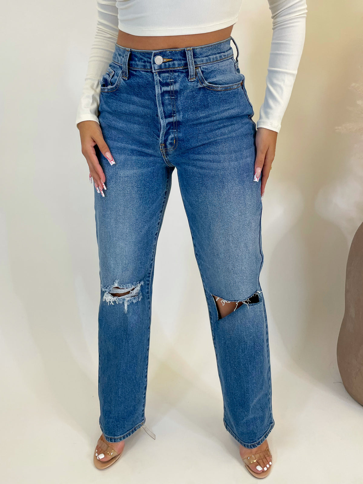 medium denim distressed jeans, high waisted, mom jean fit, 2 front/back pockets  