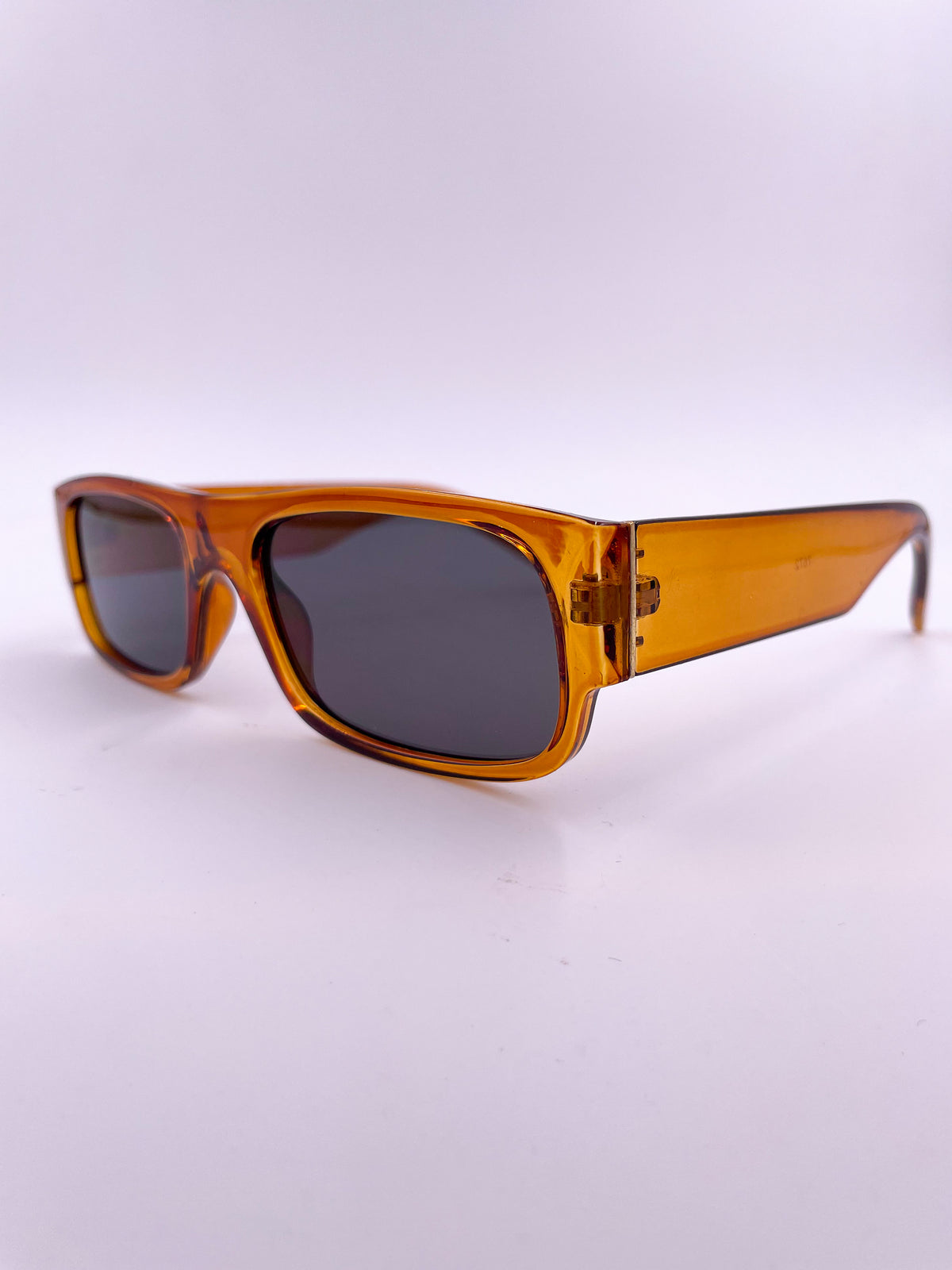 orange sunglasses, rectangular frame, dark lens, thick arms/nose bridge
